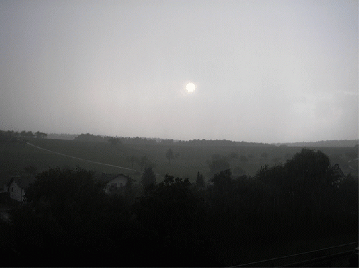 2007-09-Sonnenuntergang durch Regenwand - Odenwald