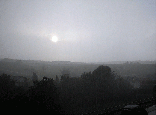 2007-09-cara-Sonnen-Untergang durch Regenwand aufgenommen - Odenwald
