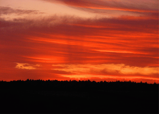 2009-09-cea-Fächerschatteneffekt durch Wolken am Horizont bei Sonnenuntergang
